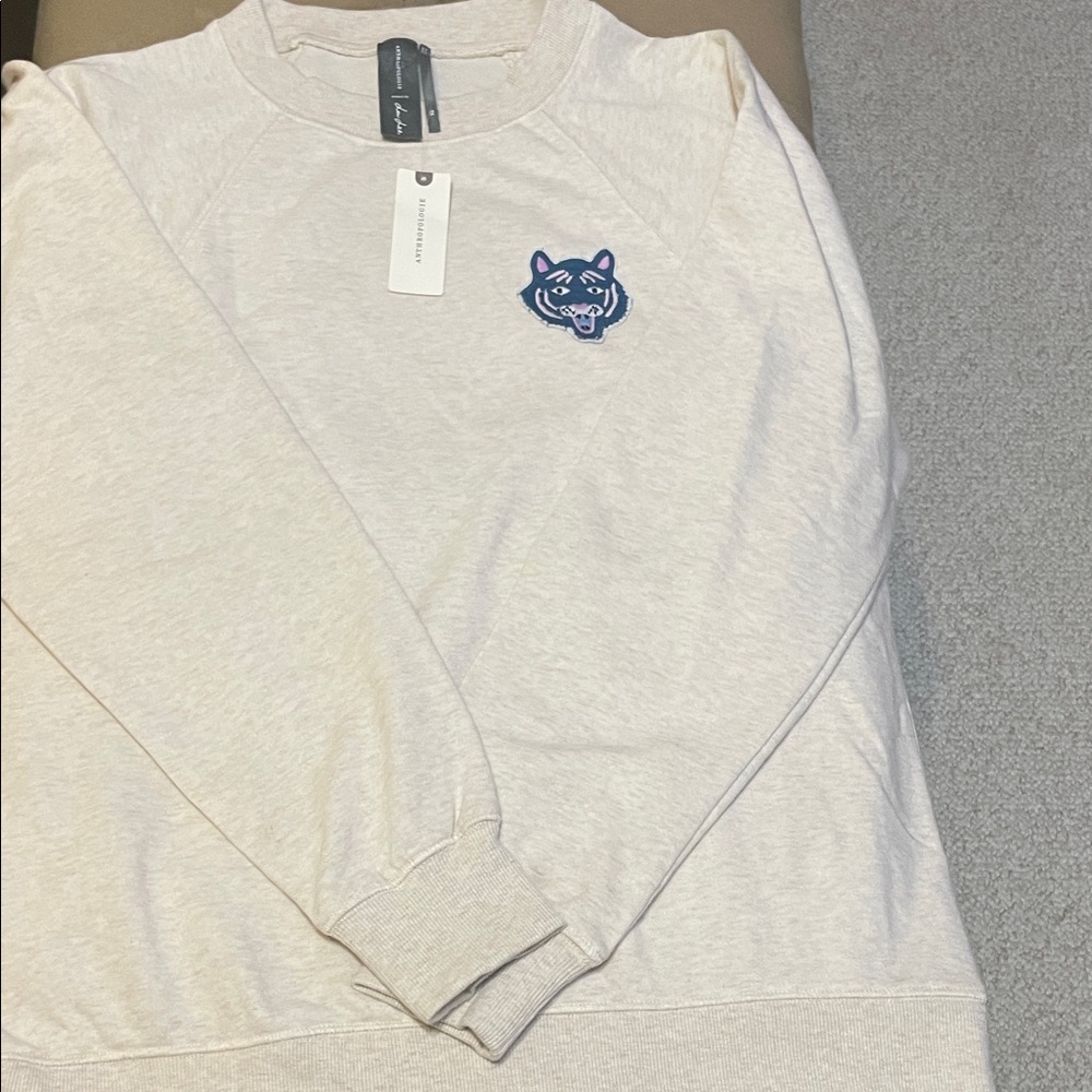 Anthropologie Cream Crewneck Sweater with Blue Patch